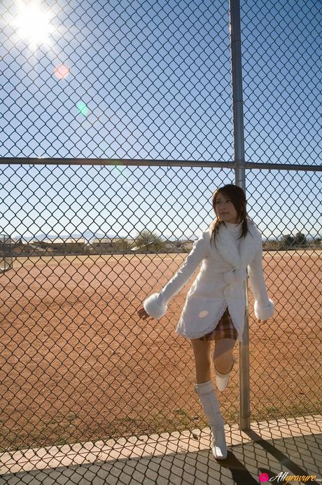 Asian teen Leah Dizon gets naked in a backyard before a swim