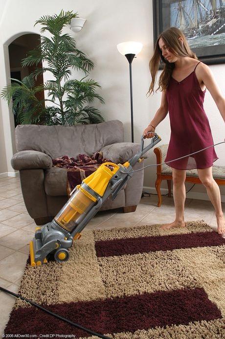 Amateur housewife Maddy shows off her hairy pussy while doing housework