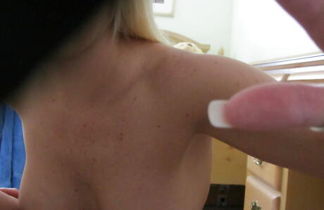 Delightful blonde milf Mandy revealing big hooters and sexy ass 