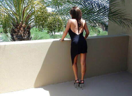 Very attractive american older Sandra Otterson in sexy skirt exposes big tits and hot ass outside