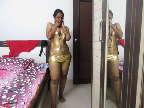 Dark-Haired indian Milf Lily Singh displays her big tits and shows off her undraped figure in a solo