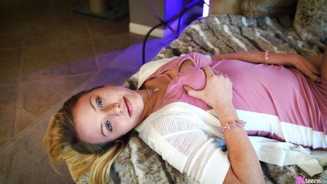 Dixie offers you a peek of her white panties, spreading her legs and hik