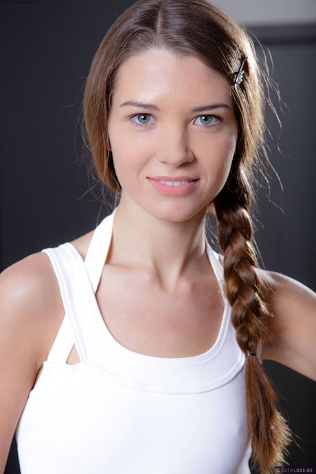 Slender russian cutie Tini removes her bodysuit and toys her pussy in a solo