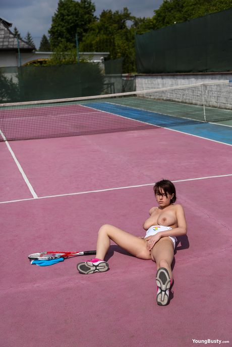 Alluring czech babe Anabelle strips and masturbates on the balcony