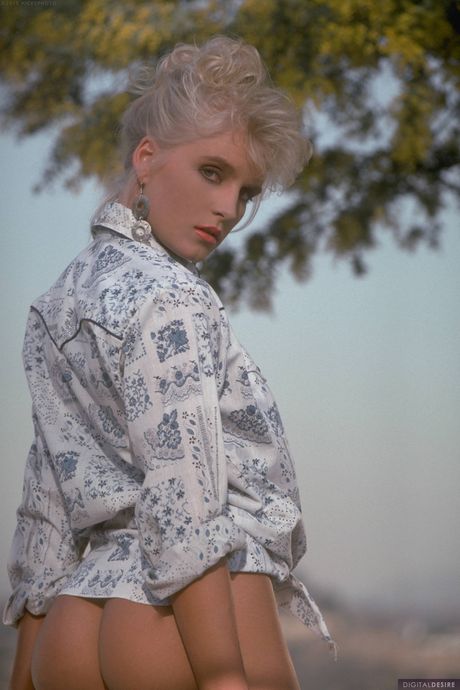 Blonde magazine-model Therese Ferguson displays her big juggs and hairy pussy