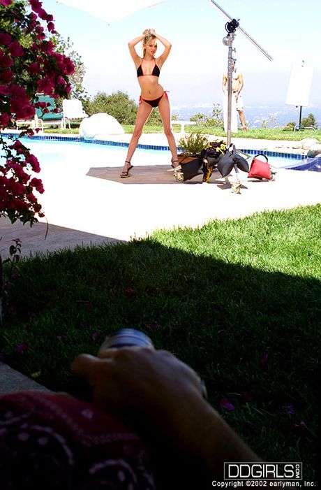 Blond american poster-girl Lily Ann demonstrates her hot body in a bikini by the pool