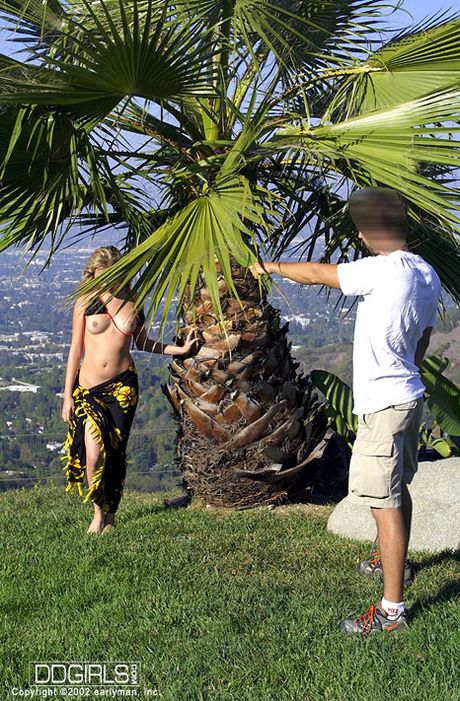 Blond american poster-girl Lily Ann demonstrates her hot body in a bikini by the pool
