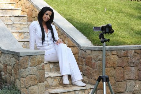 Fantastic hungarian brunette Larissa Dee reveals her big juggs and poses in a solo