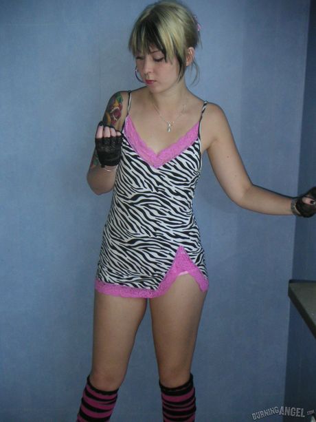 Tiny Tiny is a tattooed vixen with a big smile and a tiny ass