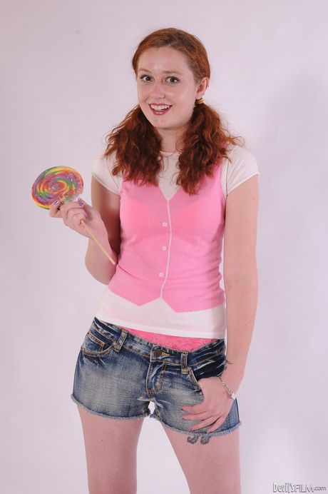 Hot redhead young Meloney Danells in sexy underwear revealing her ass 