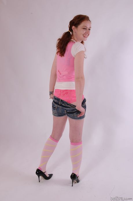 Hot redhead young Meloney Danells in sexy underwear revealing her ass 