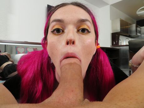 Pink haired Natalie Stone highlights her massive tits and gives a blowjob