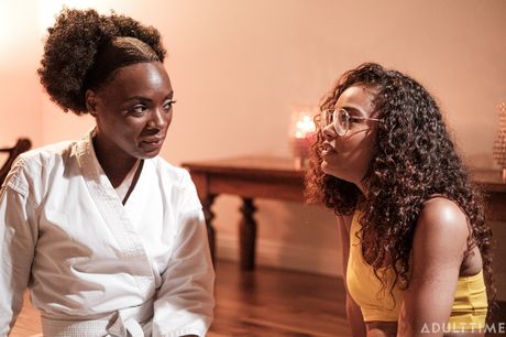 Lesbian lovers Ana Foxxx and Scarlit Scandal kiss and caress each other