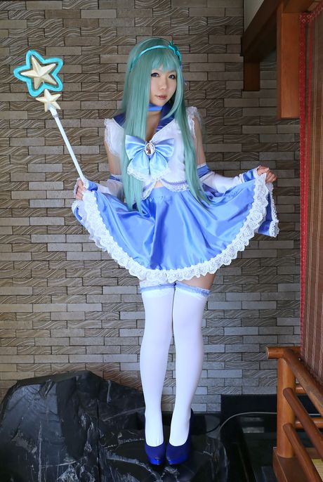 Asian stunner Higurashi Rin models a dress and stockings in a hallway