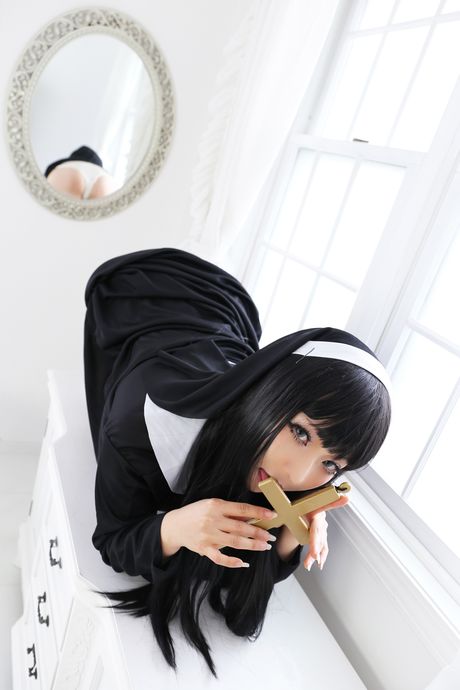 Asian nun Higurashi Rin strips to her stockings and poses in a solo