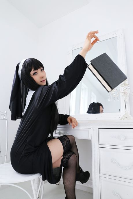 Asian nun Higurashi Rin strips to her stockings and poses in a solo