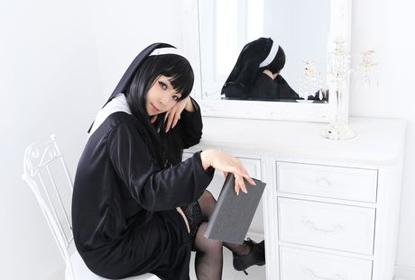 Asian nun Higurashi Rin strips to her stockings and poses in a solo