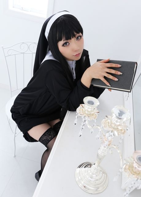 Asian nun Higurashi Rin strips to her stockings and poses in a solo