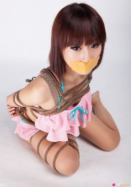 Asian teen Ayako gets tied up in a rope bondage and gagged