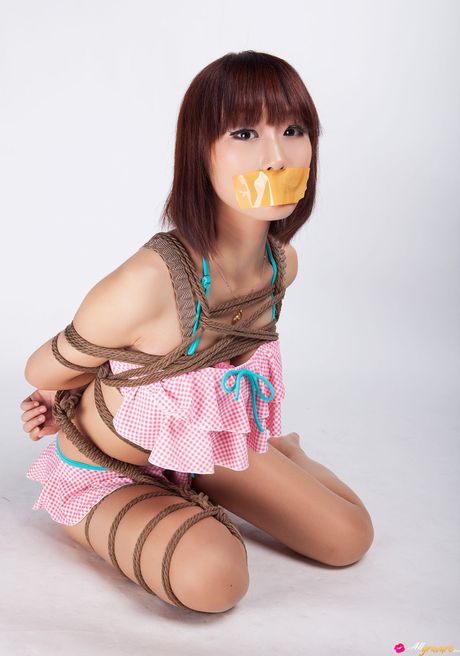 Asian teen Ayako gets tied up in a rope bondage and gagged