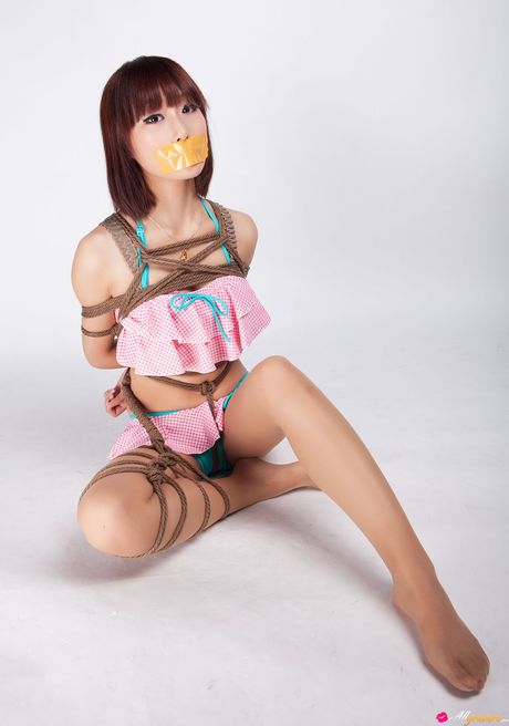 Asian teen Ayako gets tied up in a rope bondage and gagged