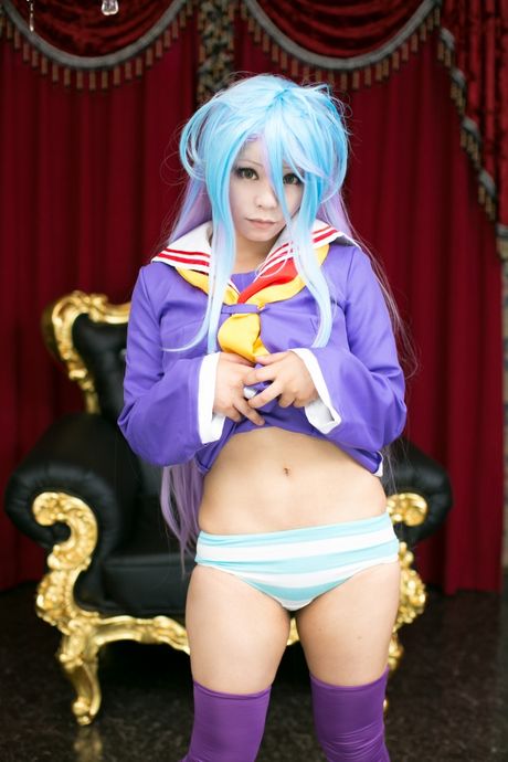 Asian schoolgirl Rat Sakura wears a pink dress and panties in solo action