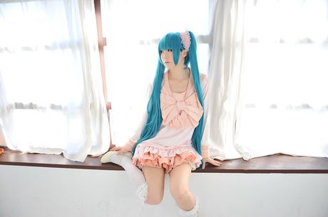 Asian cutie Haruka flaunts her natural small tits and poses in a hot striped outfit