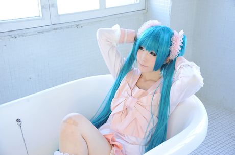 Asian cutie Haruka flaunts her natural small tits and poses in a hot striped outfit