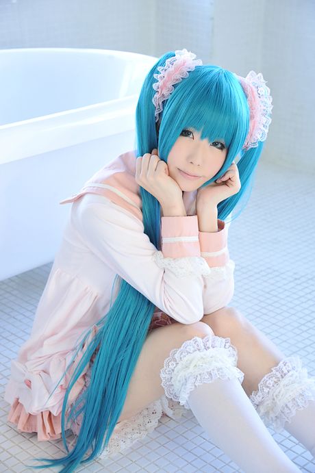 Asian cutie Haruka flaunts her natural small tits and poses in a hot striped outfit