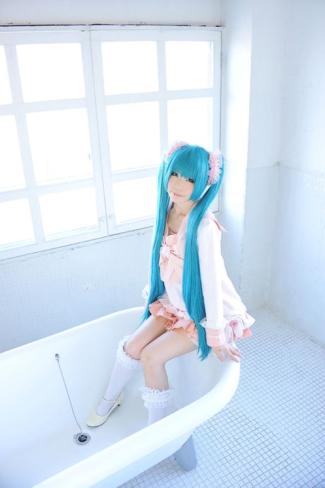 Asian cutie Haruka flaunts her natural small tits and poses in a hot striped outfit