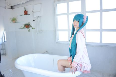 Asian cutie Haruka flaunts her natural small tits and poses in a hot striped outfit