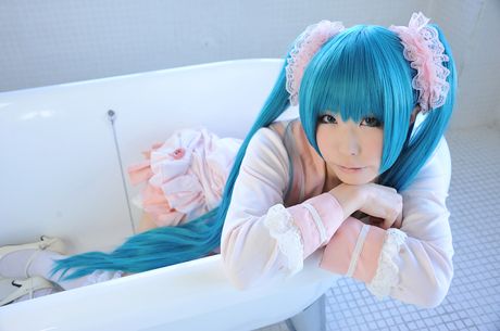 Asian cutie Haruka flaunts her natural small tits and poses in a hot striped outfit