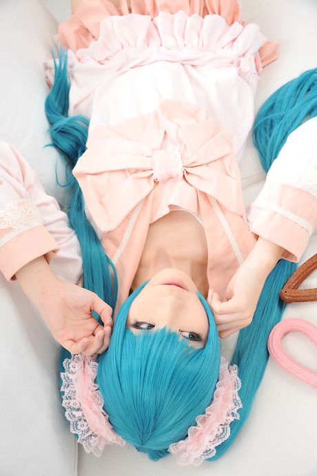 Asian cutie Haruka flaunts her natural small tits and poses in a hot striped outfit