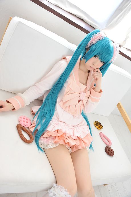 Asian cutie Haruka flaunts her natural small tits and poses in a hot striped outfit