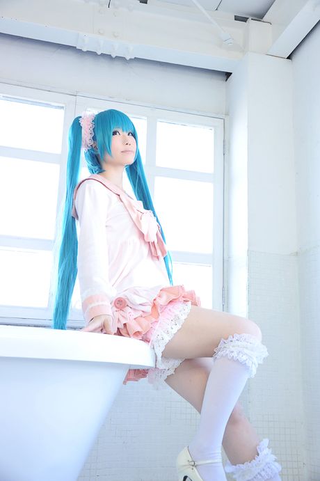 Asian cutie Haruka flaunts her natural small tits and poses in a hot striped outfit