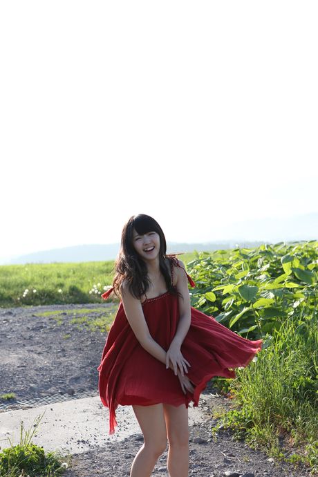 Asian girl Airi Suzuki gets naked on a blanket in a field of wildflowers