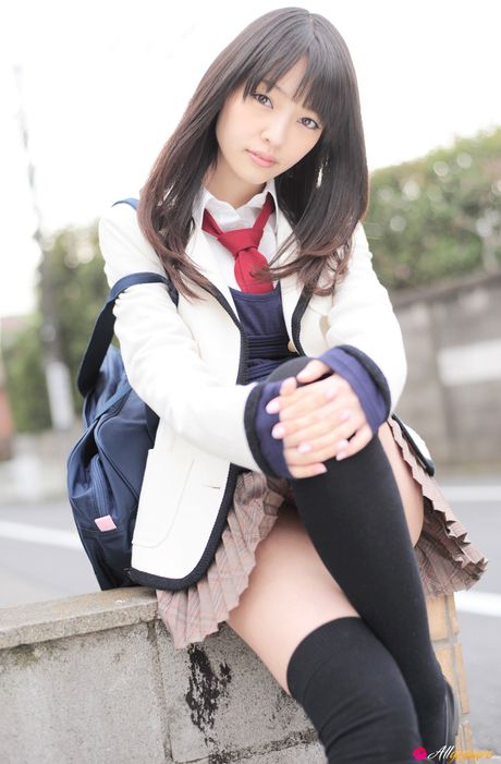 Asian cutie Haruka Ando highlights her small tits and poses in stockings