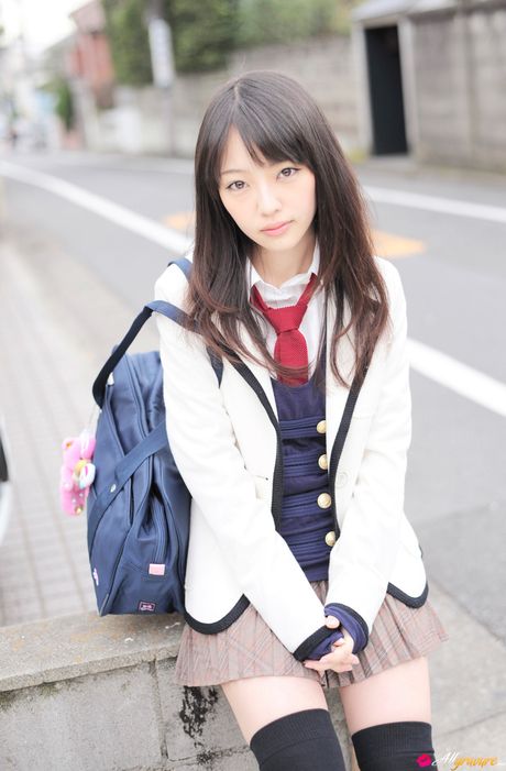 Asian cutie Haruka Ando highlights her small tits and poses in stockings