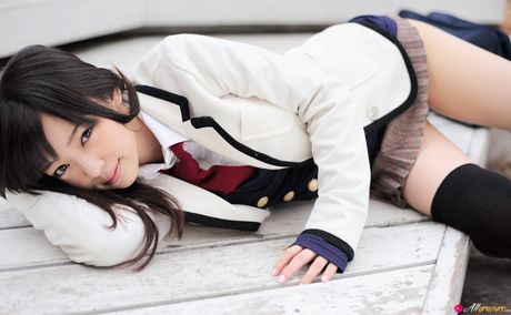 Asian cutie Haruka Ando highlights her small tits and poses in stockings