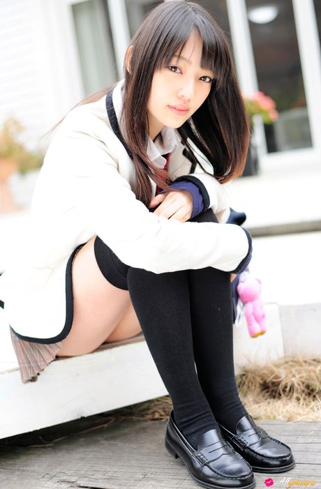 Asian cutie Haruka Ando highlights her small tits and poses in stockings