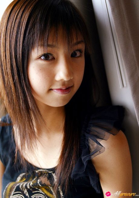 Asian beauty Yuko Ogura shows her tiny boobs and bald pussy in a solo