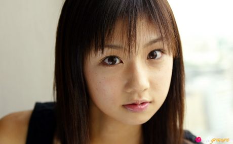 Asian beauty Yuko Ogura shows her tiny boobs and bald pussy in a solo