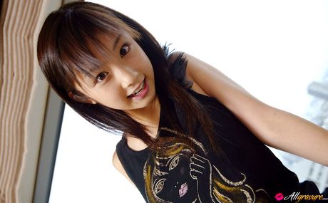 Asian beauty Yuko Ogura shows her tiny boobs and bald pussy in a solo