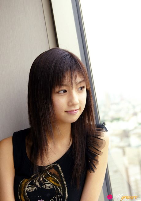 Asian beauty Yuko Ogura shows her tiny boobs and bald pussy in a solo