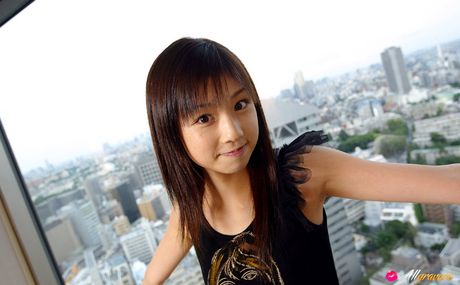 Asian beauty Yuko Ogura shows her tiny boobs and bald pussy in a solo