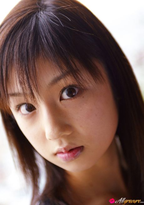 Asian beauty Yuko Ogura shows her tiny boobs and bald pussy in a solo