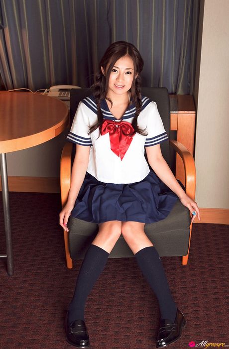 She shows her firm tits and sexy ass in a solo striptease