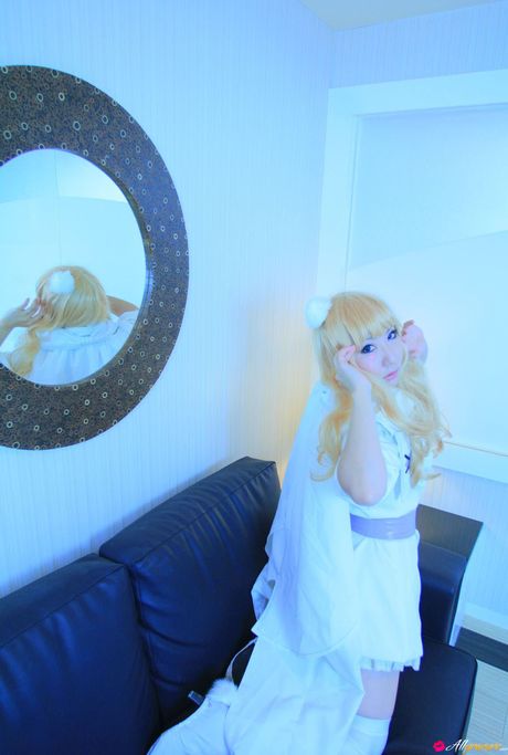 Asian cutie Saku gets naked in white stockings before a bath