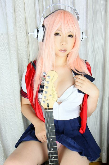 Pink haired teen Higurashi Rin flaunts her petite small tits and pussy in a solo