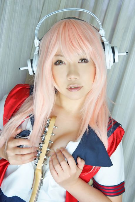 Pink haired teen Higurashi Rin flaunts her petite small tits and pussy in a solo